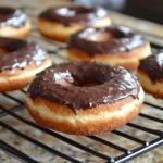 Gluten-free donuts with chocolate and vanilla glaze on a plate