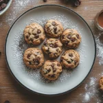 What are some fun facts about chocolate chip cookies? Freshly baked chocolate chip cookies on a tray.