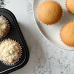 A top-down view of gluten-free cupcakes featuring What is a good egg substitute for gluten-free cupcakes? in a home kitchen.
