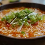 A bowl of rice soup with vegetables. Can I add rice directly to soup?